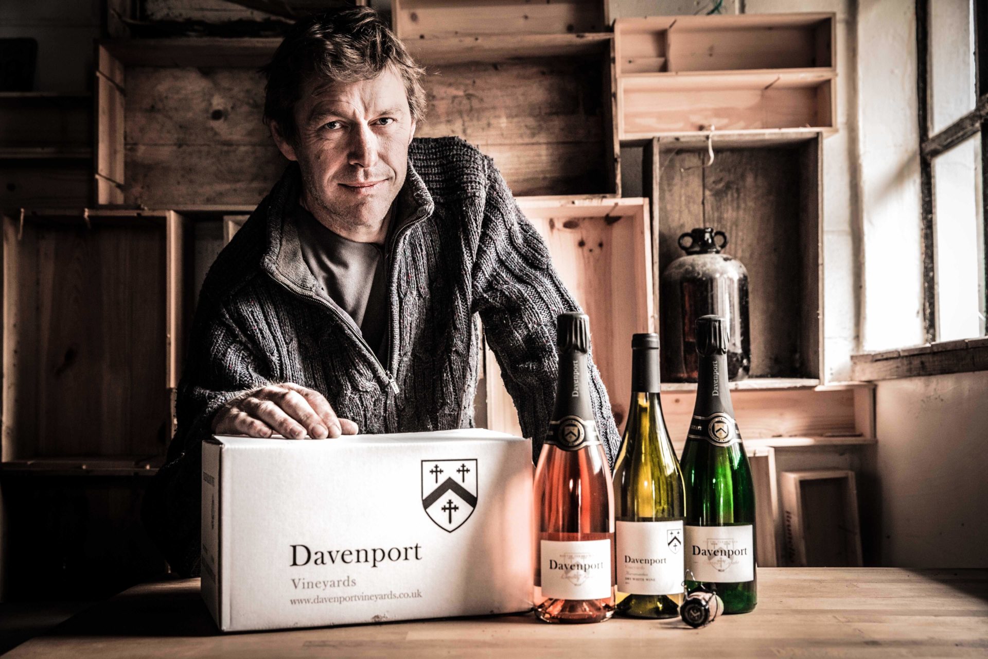 man in a shed with wine bottles swindells east sussex tax and accounting services