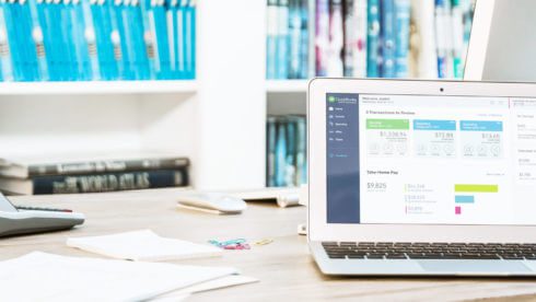 laptop on desk with paper swindells east sussex tax and accounting services