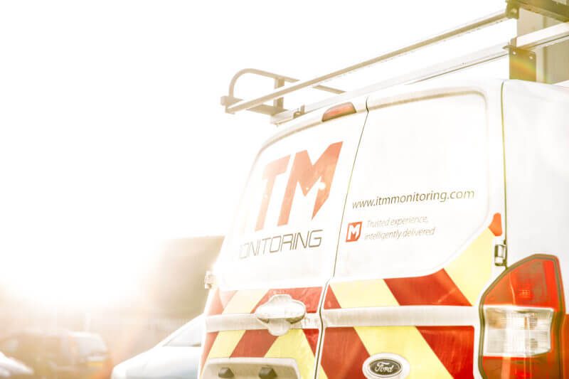 van in a carpark of a warehouse