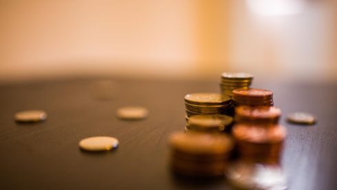 Pile of coins on desk swindells east sussex accounting and tax