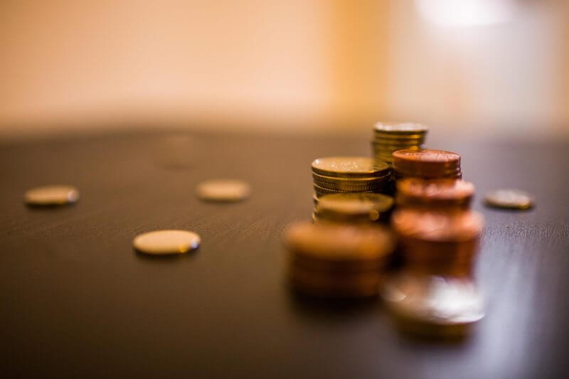 Pile of coins on desk swindells east sussex accounting and tax