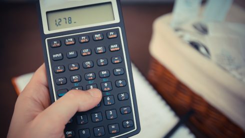 Swindells Sussex Accounting calculator in hand