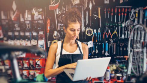 Swindells Accountants East Sussex woman looking at laptop