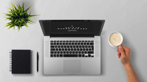 East sussex accountants tidy taxes laptop on a desk with coffee