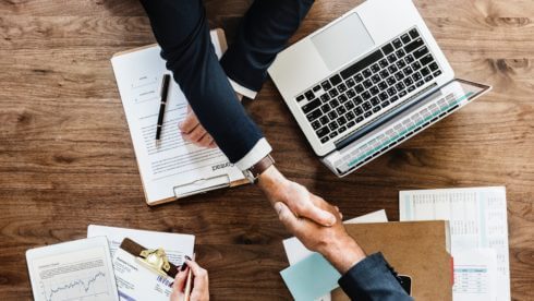 business shaking hands small business taxes swindells sussex