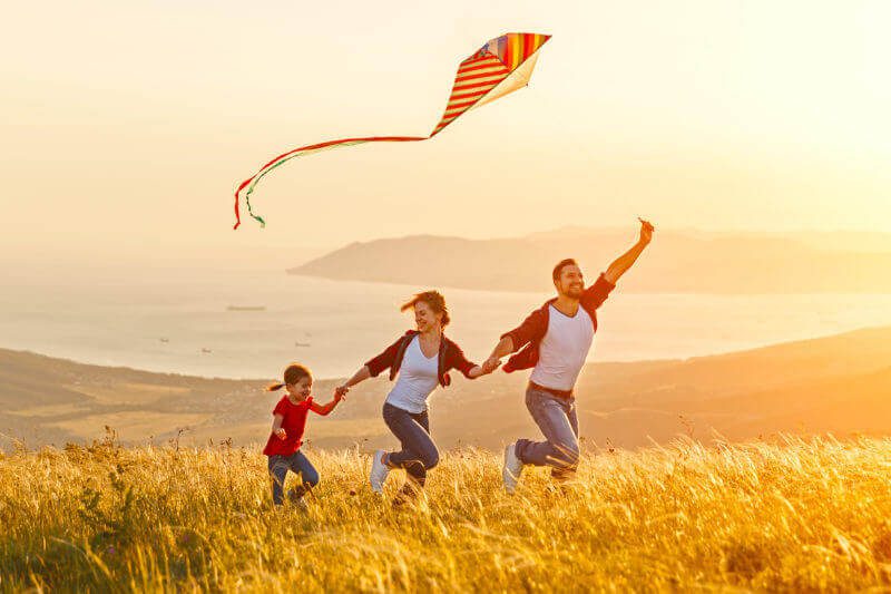 Happy Family with kite Swindells Accounting