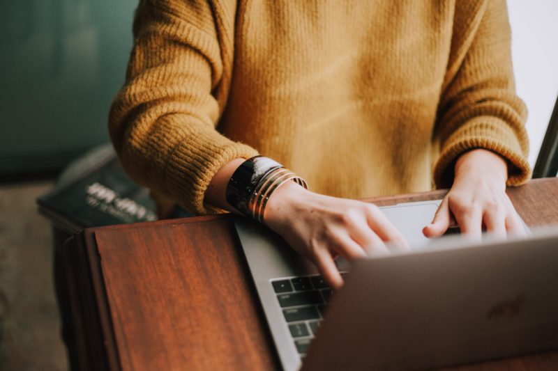 Woman sat at laptop self assessment tax return